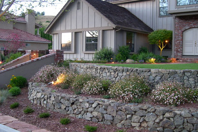 Inspiration for a mid-sized traditional full sun front yard retaining wall landscape in San Francisco.
