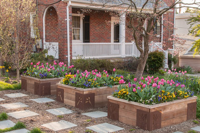 Inspiration for a small eclectic full sun front yard stone landscaping in DC Metro for spring.