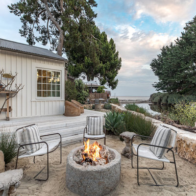 Inspiration for a mid-sized coastal full sun backyard landscaping in San Luis Obispo with a fire pit for summer.