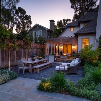This is an example of a mid-sized contemporary partial sun backyard stone formal garden in San Francisco for spring.