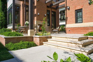 This is an example of a small contemporary backyard stone landscaping in Chicago.