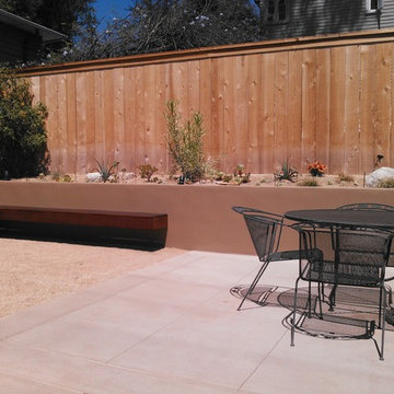 Contemporary Landscape with custom concrete work and stucco retaining wall