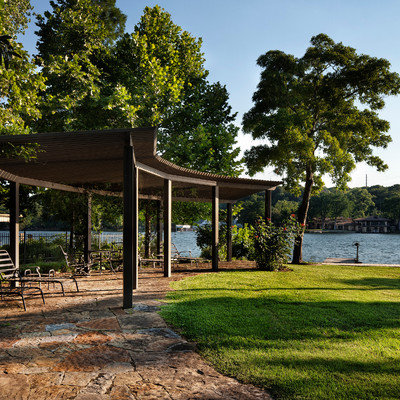 Photo of a traditional backyard stone landscaping in Austin.