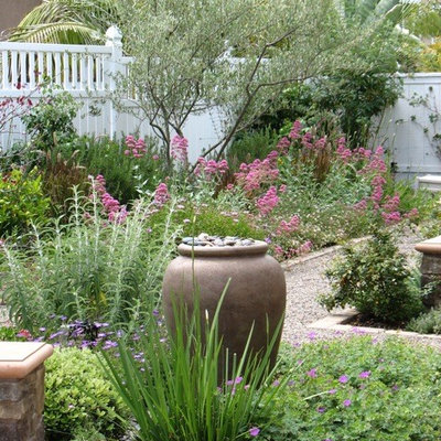 Design ideas for a mid-sized shabby-chic style full sun backyard gravel garden path in San Diego.