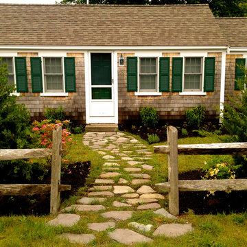Cottage style Cape Cod planting and stepping stone path