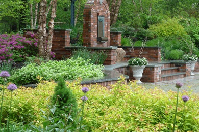 Inspiration for a traditional stone formal garden in Boston.