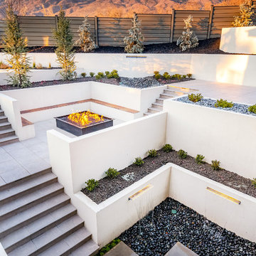 Retaining Walls And Fire Pit In Modern Landscape