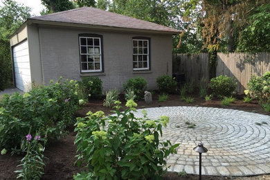 Design ideas for a mid-sized eclectic full sun backyard stone formal garden in New York for summer.