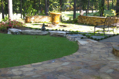 Crescent lawn with flagstone patio