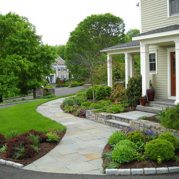Curved stone walkway leads to front door