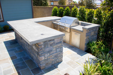 Back patio in Orange County with natural stone paving.