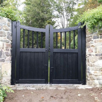 Inspiration for a large traditional backyard stone landscaping in New York.