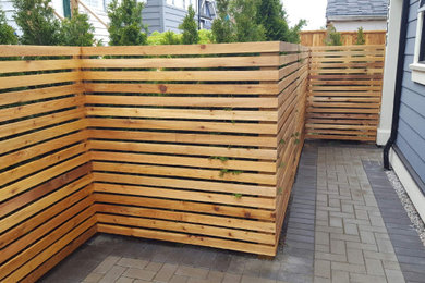 Inspiration for a small modern full sun backyard landscaping in Vancouver for summer.
