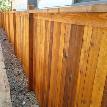 Custom cedar fence stained with Sikkens Natural