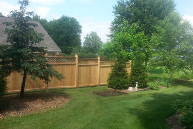 Design ideas for a large craftsman full sun backyard landscaping in Detroit for spring.