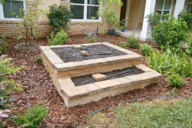 Design ideas for a small craftsman full sun front yard concrete paver landscaping in Orlando for fall.
