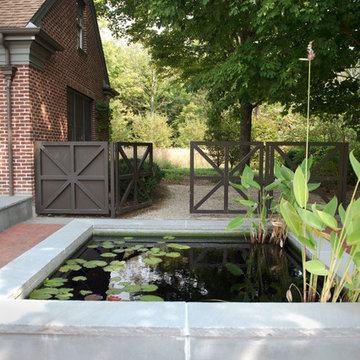 Custom steel gates with raised bluestone reflecting pool