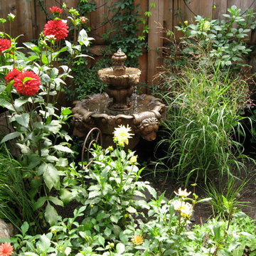Dahlias, grasses, and water fountain