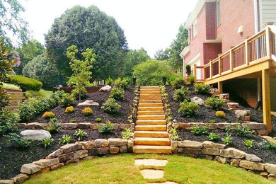 Design ideas for a large traditional side yard stone landscaping in Atlanta.