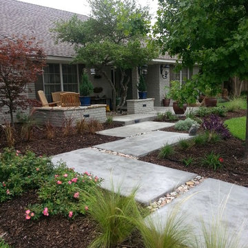 Designed and installed flag stone patio, walk way, boulders and perennial beds