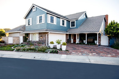 Inspiration for a mid-sized transitional drought-tolerant brick landscaping in Orange County.