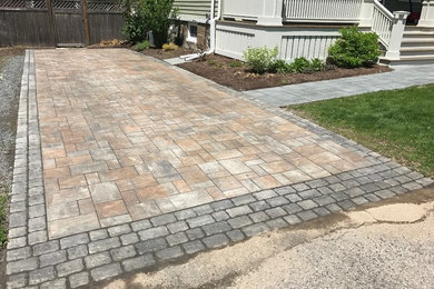 Design ideas for a mid-sized rustic full sun front yard concrete paver driveway in Boston.