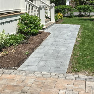 driveway and walkway with granite cobble border