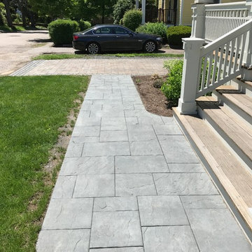 driveway and walkway with granite cobble border