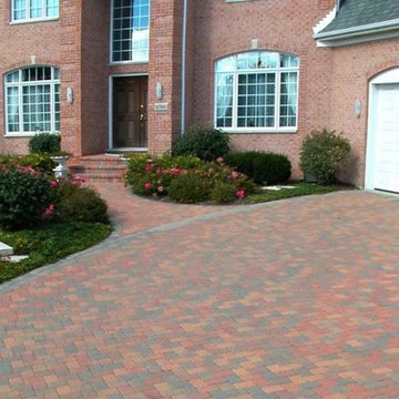 Driveway featuring Unilock Camelot paver with Brussels Block banding