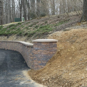 Driveway retaining wall w/ end pillar, cap & lighting