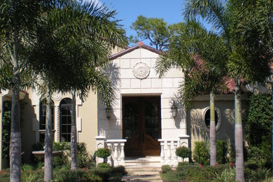 This is an example of a mediterranean partial sun front yard landscaping in Miami.