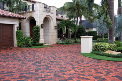 This is an example of a front yard brick driveway in Tampa.