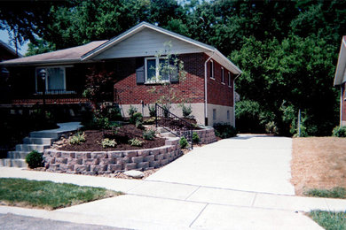 This is an example of a medium sized front full sun garden in Cincinnati with natural stone paving.