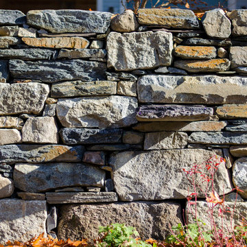 Dry laid fieldstone, reclaimed granite, and Goshen stone wall with stone shelf
