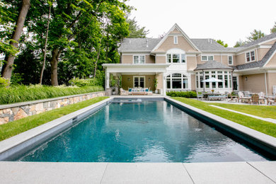 Design ideas for a transitional full sun stone landscaping in Boston.