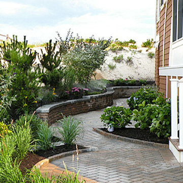 Dune retaining wall with beach plantings and walkway