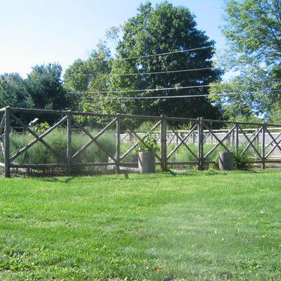 Design ideas for a large rustic full sun backyard landscaping in DC Metro with decking for summer.