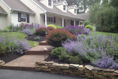 This is an example of a mid-sized traditional partial sun front yard mulch garden path in Philadelphia for summer.
