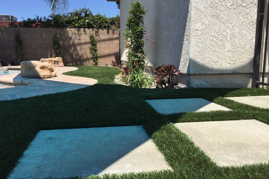 This is an example of a small back xeriscape garden in Los Angeles.