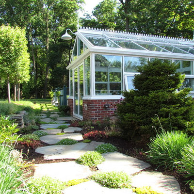 Photo of a traditional backyard stone landscaping in Philadelphia.