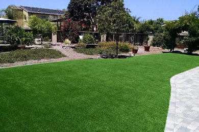 Photo of a modern front yard brick landscaping in San Diego.