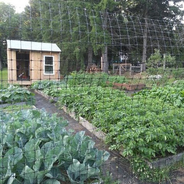 Enclosed Vegetable Garden with Raised Beds