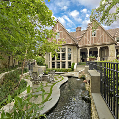 Design ideas for a traditional water fountain landscape in Dallas.