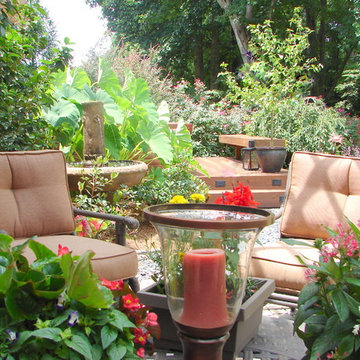 Enjoy sitting on this cozy, shady patio while listening to fountain