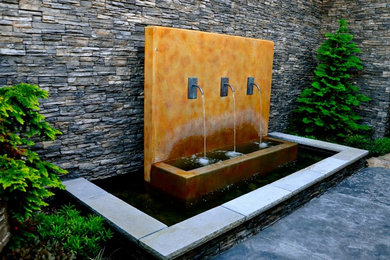 This is an example of a courtyard water fountain landscape in Seattle.