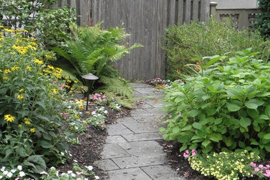 Inspiration for a small traditional full sun side yard stone landscaping in New York for spring.