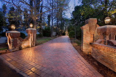 This is an example of a huge traditional front yard brick driveway in San Diego.
