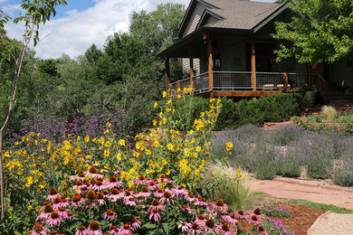 Design ideas for a large southwestern drought-tolerant and full sun front yard stone landscaping in Denver for summer.