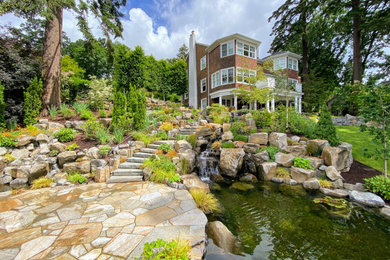 Design ideas for a large classic garden in Portland with a waterfall.