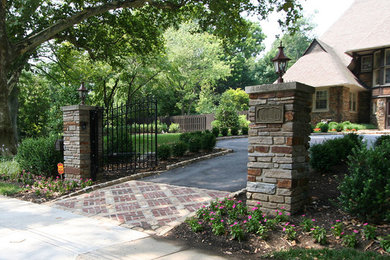 Inspiration for a mid-sized traditional partial sun front yard brick driveway in Philadelphia.
